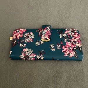Little blue flowered wallet from Walmart. 7in x 4in. Excellent condition.